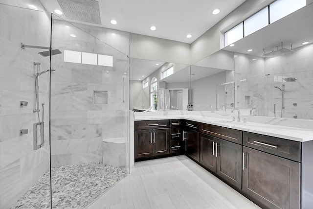 10523 Vignon Ct, Wellington, FL 33449 - bathroom featuring a marble finish shower, healthy amount of natural light, vanity, and recessed lighting