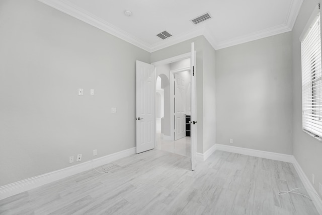 10523 Vignon Ct, Wellington, FL 33449 - unfurnished bedroom with arched walkways, light wood-style flooring, ornamental molding, and multiple windows