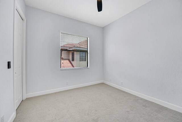 10523 Vignon Ct, Wellington, FL 33449 - empty room featuring ceiling fan, light carpet, and baseboards