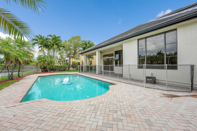 10523 Vignon Ct, Wellington, FL 33449 - view of swimming pool featuring a patio area