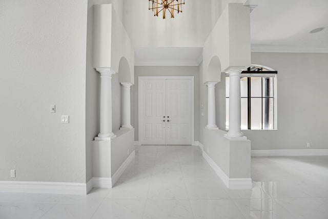 10523 Vignon Ct, Wellington, FL 33449 - entrance foyer with light marble finish floors, baseboards, a chandelier, and ornamental molding
