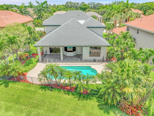 10523 Vignon Ct, Wellington, FL 33449 - rear view of house with stucco siding, a patio, and a tiled roof