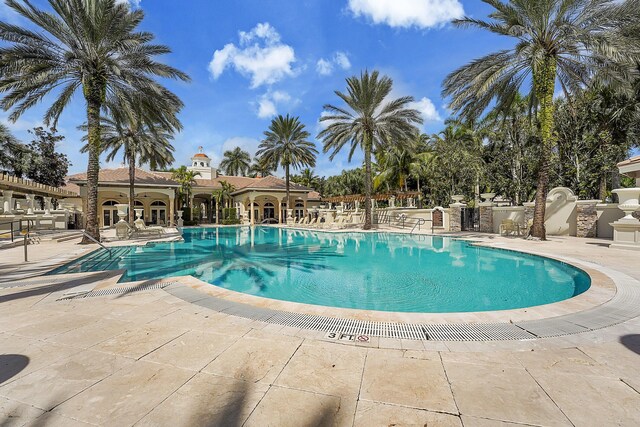 10523 Vignon Ct, Wellington, FL 33449 - community pool featuring a patio area and french doors