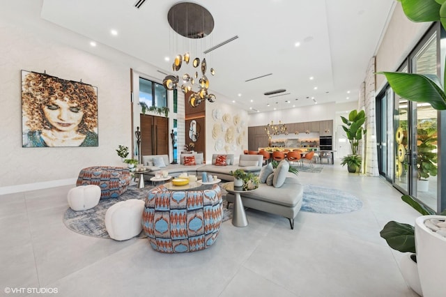 8533 N Native Dancer Rd, Palm Beach Gardens, FL 33418 - living area with recessed lighting, plenty of natural light, french doors, and a chandelier