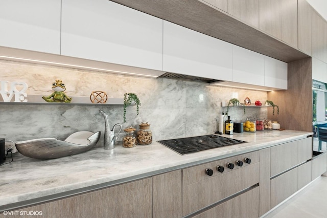 8533 N Native Dancer Rd, Palm Beach Gardens, FL 33418 - kitchen featuring gas cooktop, decorative backsplash, open shelves, light stone counters, and modern cabinets