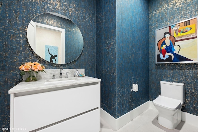 8533 N Native Dancer Rd, Palm Beach Gardens, FL 33418 - bathroom with vanity, toilet, and wallpapered walls