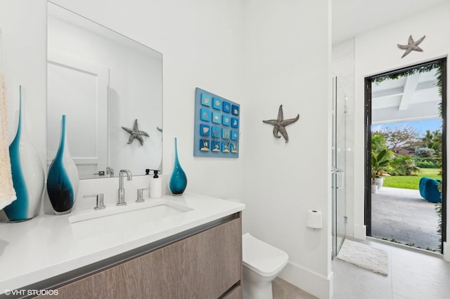 8533 N Native Dancer Rd, Palm Beach Gardens, FL 33418 - bathroom featuring vanity, toilet, an enclosed shower, and baseboards