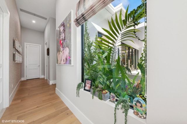 8533 N Native Dancer Rd, Palm Beach Gardens, FL 33418 - corridor with light wood-style flooring, baseboards, and recessed lighting