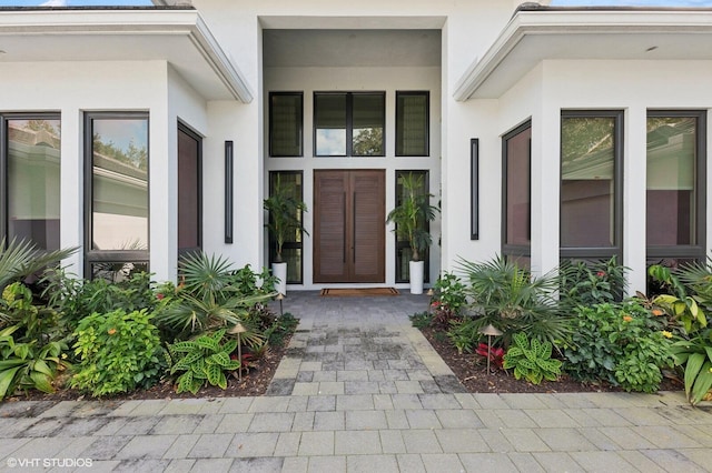 8533 N Native Dancer Rd, Palm Beach Gardens, FL 33418 - entrance to property featuring stucco siding