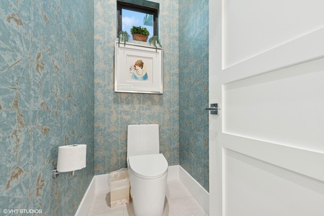 8533 N Native Dancer Rd, Palm Beach Gardens, FL 33418 - bathroom featuring baseboards, tile patterned floors, and toilet