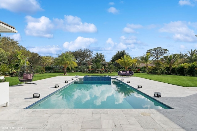 8533 N Native Dancer Rd, Palm Beach Gardens, FL 33418 - swimming pool featuring a patio area and a lawn