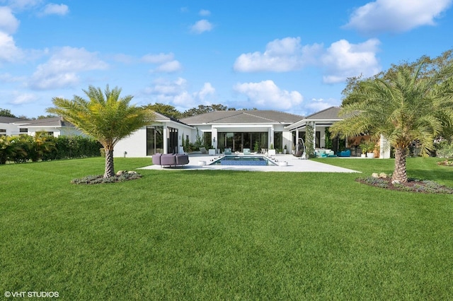 8533 N Native Dancer Rd, Palm Beach Gardens, FL 33418 - rear view of property featuring a patio area, a yard, and an outdoor pool