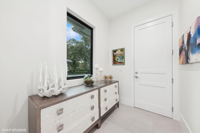 8533 N Native Dancer Rd, Palm Beach Gardens, FL 33418 - foyer entrance featuring light tile patterned floors and baseboards