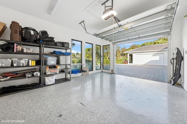 8533 N Native Dancer Rd, Palm Beach Gardens, FL 33418 - garage featuring a garage door opener