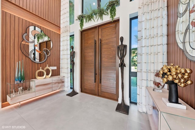 8533 N Native Dancer Rd, Palm Beach Gardens, FL 33418 - foyer entrance featuring wood walls and a high ceiling