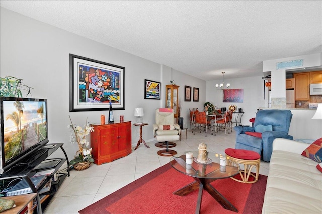 1009 N Ocean Blvd Unit 510, Pompano Beach, FL 33062 - living area featuring a chandelier, light tile patterned floors, and a textured ceiling