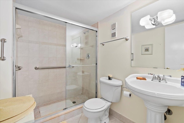 1009 N Ocean Blvd Unit 510, Pompano Beach, FL 33062 - full bath with toilet, a shower stall, tile patterned flooring, and a sink