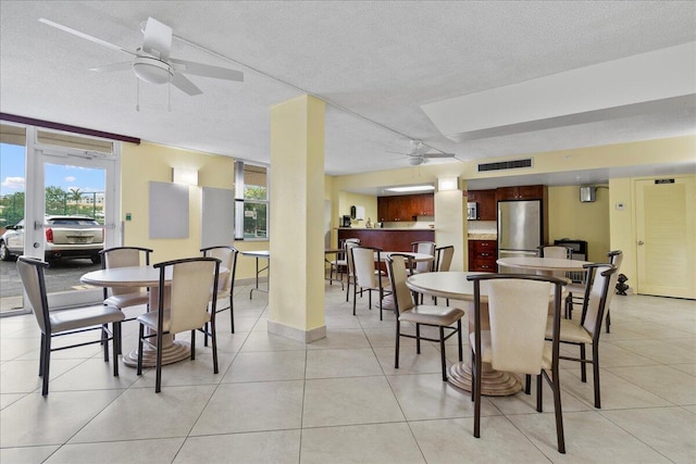 1009 N Ocean Blvd Unit 510, Pompano Beach, FL 33062 - dining room with ceiling fan, a textured ceiling, and light tile patterned floors