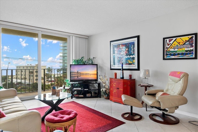 1009 N Ocean Blvd Unit 510, Pompano Beach, FL 33062 - tiled living area with floor to ceiling windows and a textured ceiling