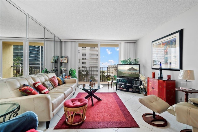 1009 N Ocean Blvd Unit 510, Pompano Beach, FL 33062 - living room featuring a textured ceiling, expansive windows, and tile patterned floors