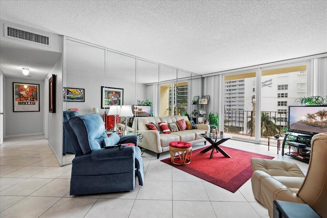 1009 N Ocean Blvd Unit 510, Pompano Beach, FL 33062 - tiled living area featuring a textured ceiling, floor to ceiling windows, and baseboards