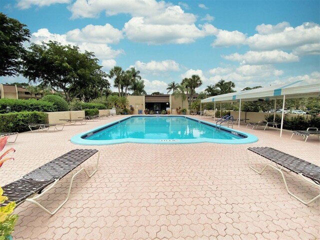 4236 Deste Ct Unit 208, Lake Worth, FL 33467 - community pool featuring a patio area