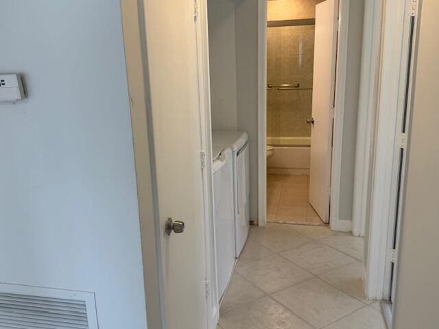 1906 Palmland Dr Unit D, Boynton Beach, FL 33436 - hall with washer and dryer and light tile patterned floors