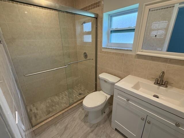 1906 Palmland Dr Unit D, Boynton Beach, FL 33436 - bathroom with toilet, vanity, tile walls, and a stall shower