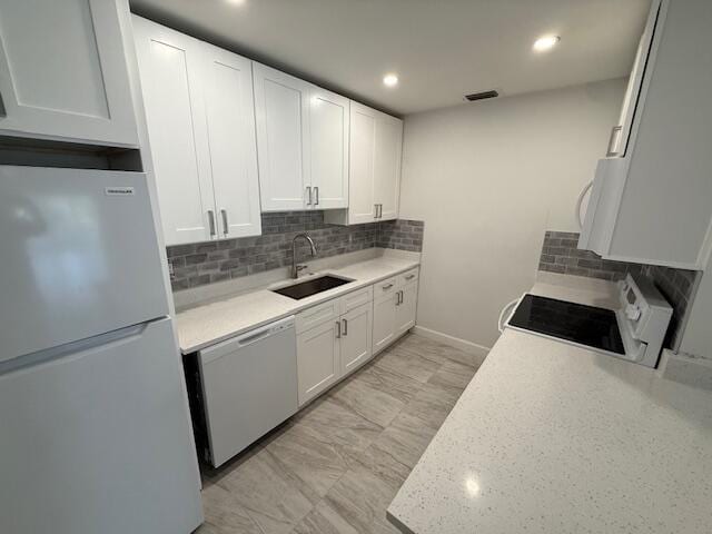 1906 Palmland Dr Unit D, Boynton Beach, FL 33436 - kitchen featuring freestanding refrigerator, dishwasher, a sink, range, and light countertops