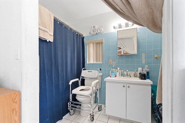 1045 NW 47th Ter, Miami, FL 33127 - full bathroom with vanity, tile patterned flooring, and tile walls