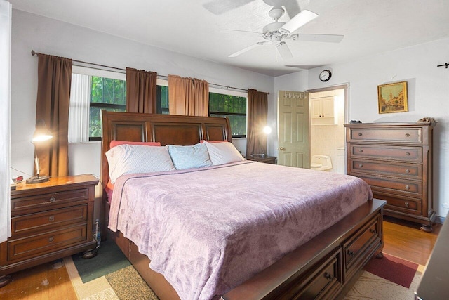 1045 NW 47th Ter, Miami, FL 33127 - bedroom with wood finished floors, connected bathroom, and a ceiling fan