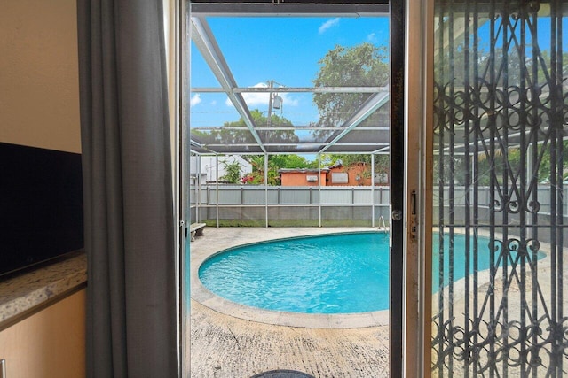 1045 NW 47th Ter, Miami, FL 33127 - view of swimming pool with a patio and glass enclosure