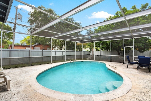 1045 NW 47th Ter, Miami, FL 33127 - view of swimming pool with a patio area, a fenced backyard, and glass enclosure