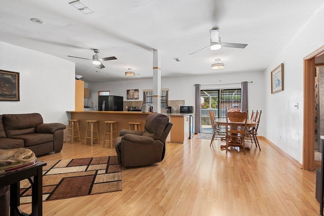 1045 NW 47th Ter, Miami, FL 33127 - living area with ceiling fan and light wood-type flooring