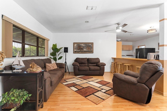 1045 NW 47th Ter, Miami, FL 33127 - living area featuring light wood-type flooring and a ceiling fan