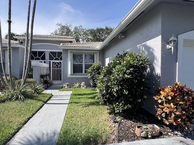 9875 Crescent View Dr S, Boynton Beach, FL 33437 - view of front of home featuring stucco siding, a front yard, and a tile roof