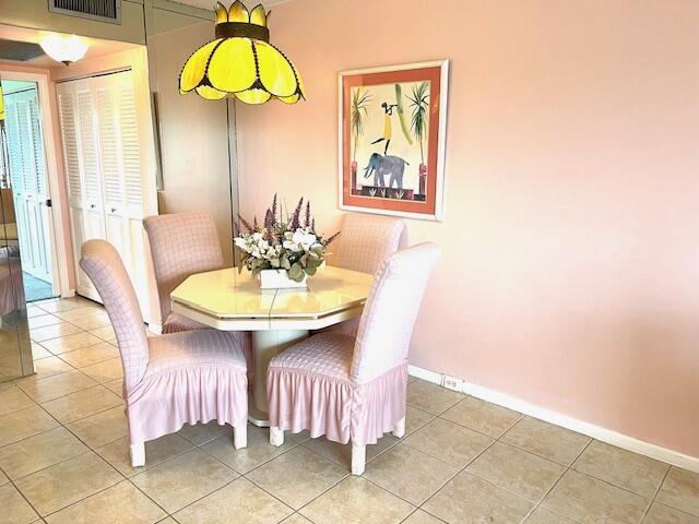 577 Mansfield N N Unit 577, Boca Raton, FL 33434 - dining space with baseboards and light tile patterned floors