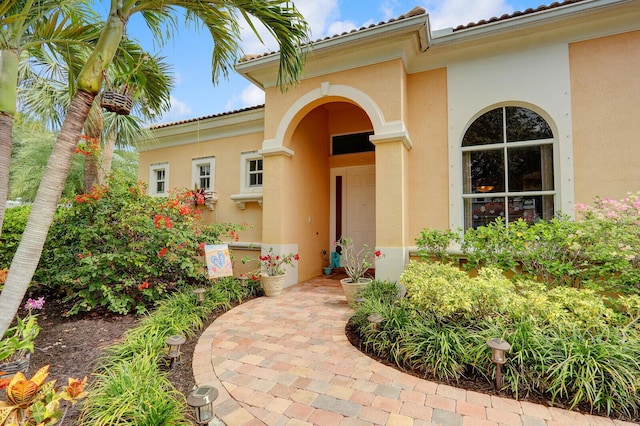 146 Magnolia Way, Tequesta, FL 33469 - doorway to property with stucco siding