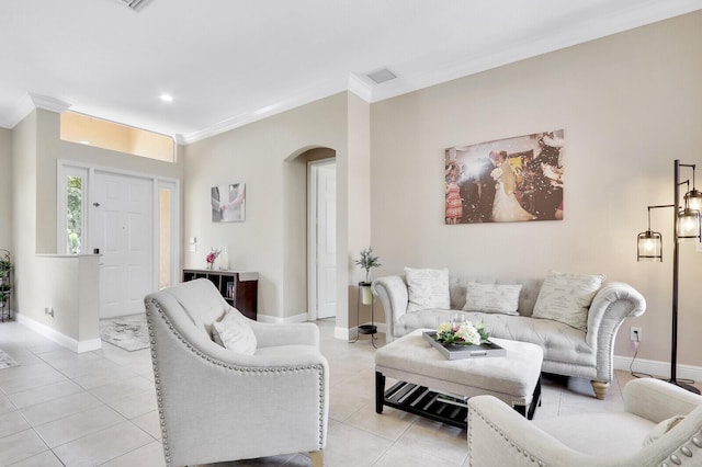 146 Magnolia Way, Tequesta, FL 33469 - living room featuring arched walkways, ornamental molding, light tile patterned flooring, baseboards, and recessed lighting
