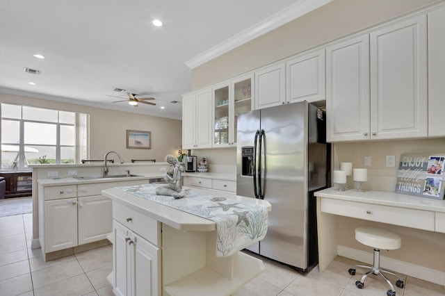 146 Magnolia Way, Tequesta, FL 33469 - kitchen featuring stainless steel refrigerator with ice dispenser, a sink, a peninsula, light countertops, and ceiling fan