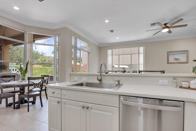 146 Magnolia Way, Tequesta, FL 33469 - kitchen featuring stainless steel dishwasher, a sink, ornamental molding, light countertops, and a ceiling fan