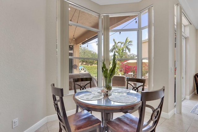 146 Magnolia Way, Tequesta, FL 33469 - dining room with light tile patterned floors, a textured wall, and baseboards