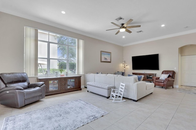 146 Magnolia Way, Tequesta, FL 33469 - living area featuring crown molding, light tile patterned floors, arched walkways, ceiling fan, and recessed lighting