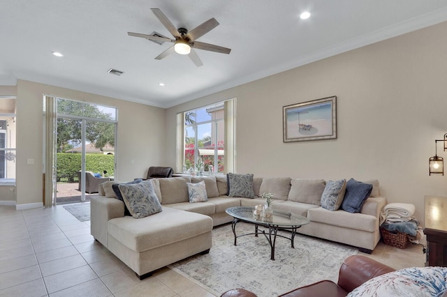 146 Magnolia Way, Tequesta, FL 33469 - living area with light tile patterned floors, plenty of natural light, ceiling fan, ornamental molding, and recessed lighting