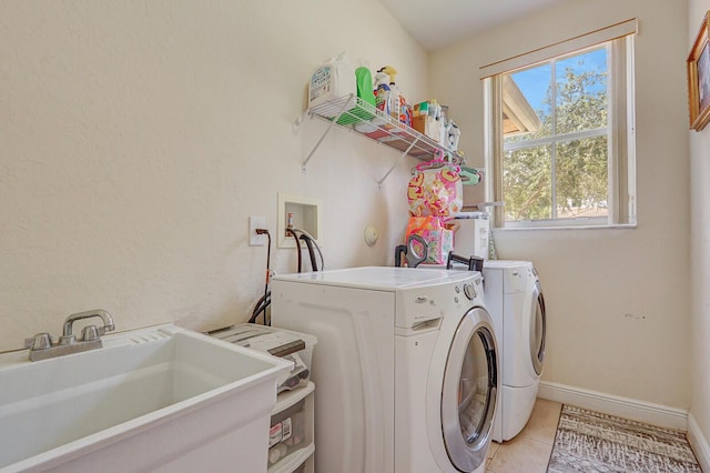 146 Magnolia Way, Tequesta, FL 33469 - washroom with washer and clothes dryer, light tile patterned floors, and baseboards