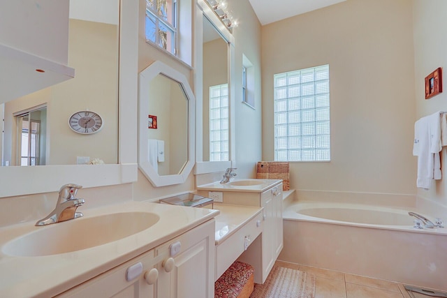 146 Magnolia Way, Tequesta, FL 33469 - bathroom featuring a garden tub, vanity, and tile patterned floors