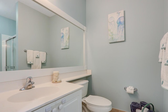 146 Magnolia Way, Tequesta, FL 33469 - bathroom featuring toilet, a stall shower, and vanity