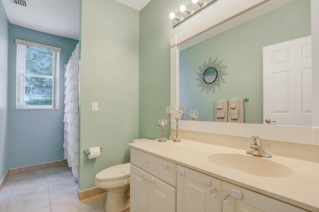 146 Magnolia Way, Tequesta, FL 33469 - full bathroom featuring baseboards, toilet, vanity, and tile patterned floors