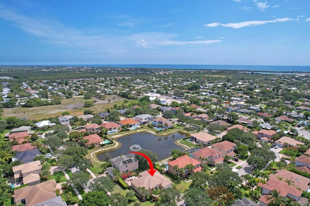 146 Magnolia Way, Tequesta, FL 33469 - aerial view of property and surrounding area featuring a large body of water and nearby suburban area