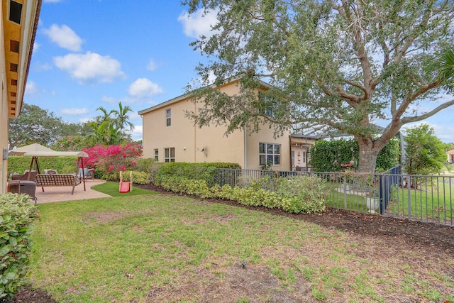 146 Magnolia Way, Tequesta, FL 33469 - view of yard featuring a patio